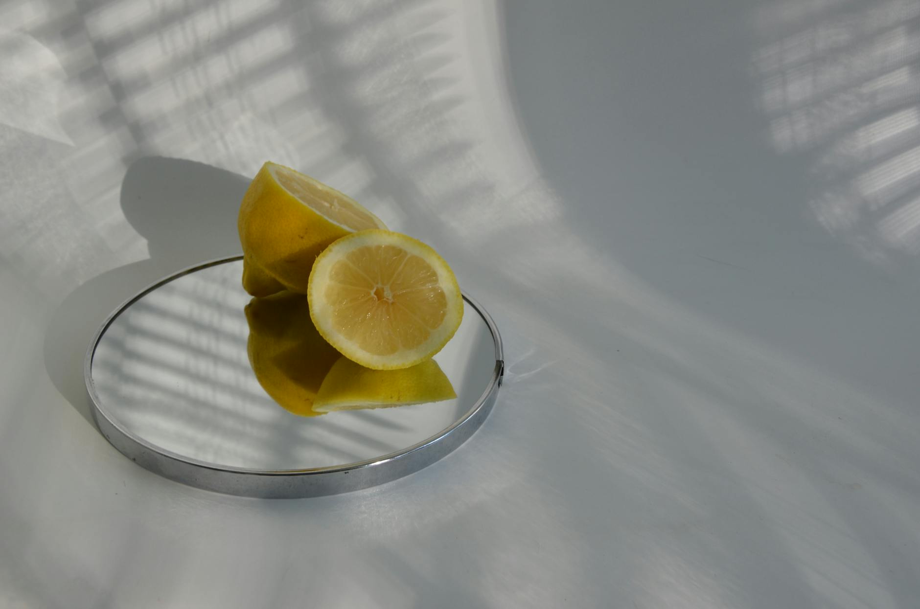 Two women laughing together with lemon slices, expressing joy and comfort in togetherness