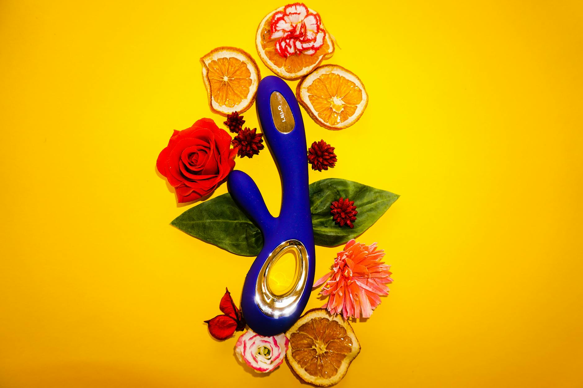 Woman using a lemon vibrator with thoughtful expression